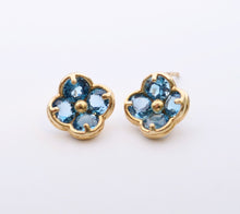 14K yellow gold flower-shaped post earrings with Blue Topaz