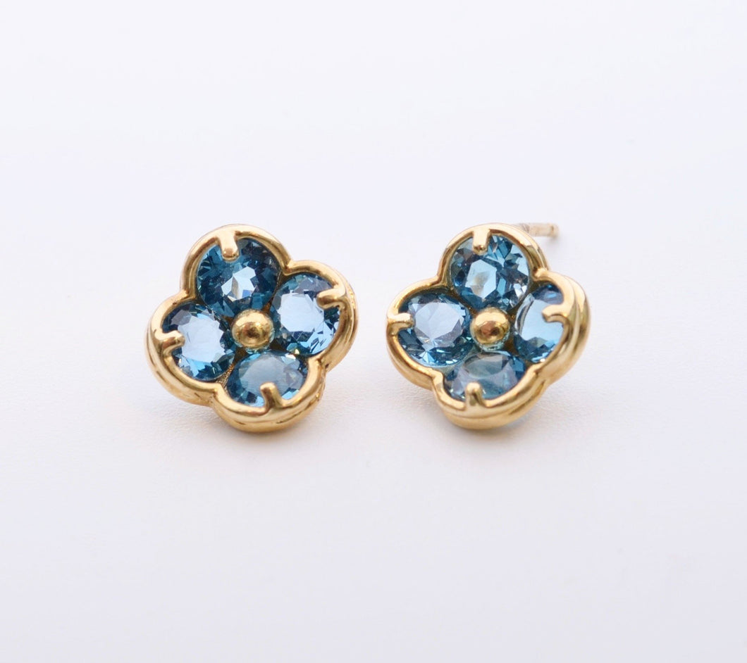 14K yellow gold flower-shaped post earrings with Blue Topaz