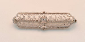 14K White gold Art Deco filigree brooch with one center .05 carat diamond