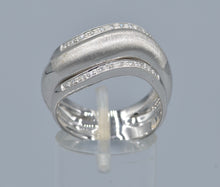 18K white gold ring with one center plain gold and two side diamond rings in one curved design