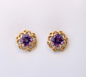 14K yellow gold post earrings with one center Amethyst and six Diamonds