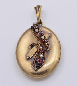 14K yellow gold locket with photo inside decorated with Rubies and seed pearls