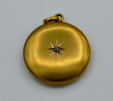 14K yellow gold locket with one diamond star burst on front
